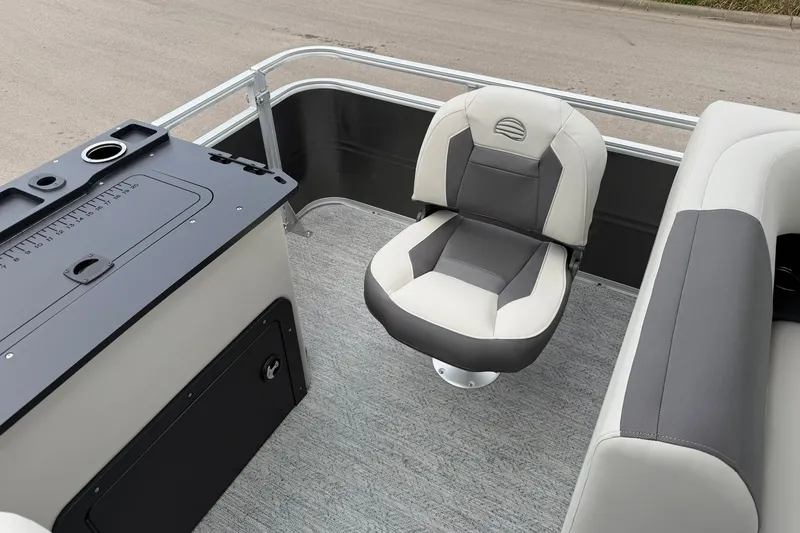 Slide: The Image of 2026 Sun Tracker Fishin' Barge 22 XP3 interior with swivel seat and fishing station. - 25
