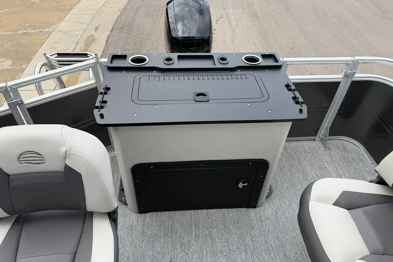 Slide: The Image of 2026 Sun Tracker Fishin' Barge 22 XP3 interior with seating and fishing station. - 22