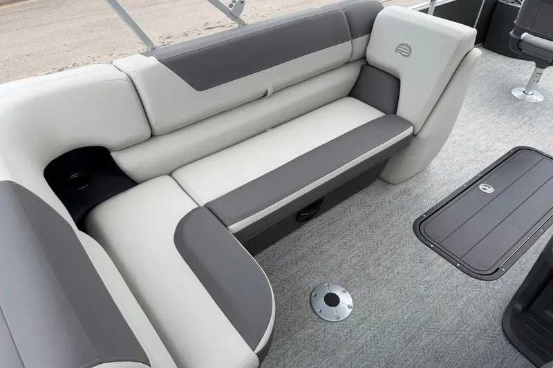 Slide: The Image of 2026 Sun Tracker Fishin' Barge 22 XP3 interior with gray seating and carpeted flooring. - 21