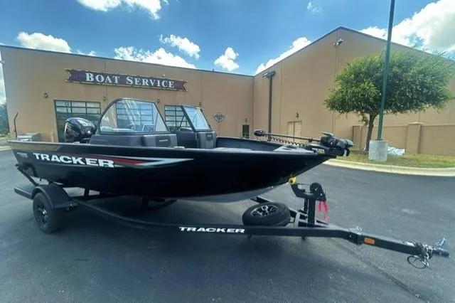 The Image of 2026 Tracker Pro Guide V-175 Combo boat on trailer outside boat service building. - 0