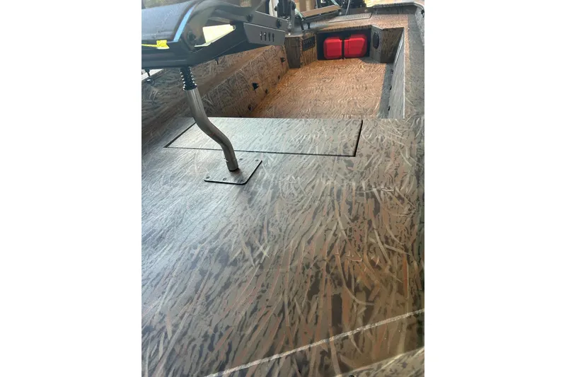 Slide: The Image of 2026 Tracker Grizzly 1650 T Prairie Wings Edition interior with camo pattern flooring. - 5