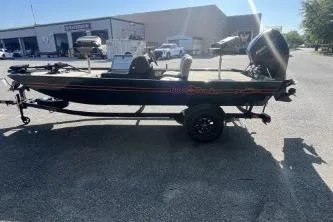 The Image of 2026 Tracker Bass Tracker Classic Limited boat on trailer in parking lot. - 0
