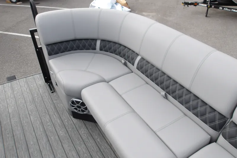 Slide: The Image of Luxurious seating on 2026 Ranger 223FC boat with quilted upholstery and integrated speaker. - 31