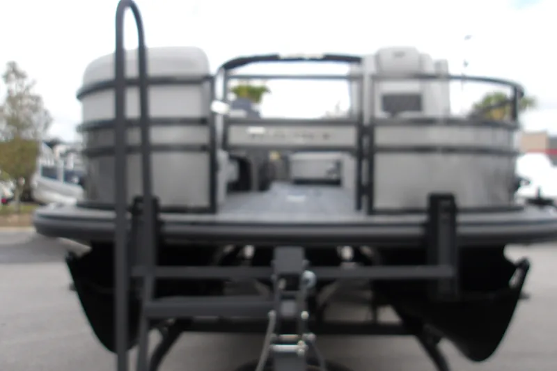 Slide: The Image of Blurry image of a 2026 Ranger 223FC pontoon boat on a trailer. - 15