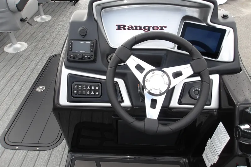 Slide: The Image of Steering console of 2026 Ranger 223FC boat with modern controls and sleek design. - 24