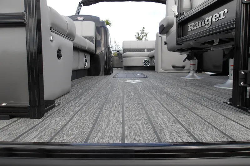Slide: The Image of 2026 Ranger 223FC boat interior with sleek gray flooring and comfortable seating. - 14