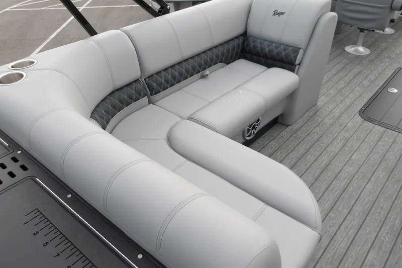 Slide: The Image of Luxurious seating on 2026 Ranger 223FC boat with elegant gray upholstery and cup holders. - 22