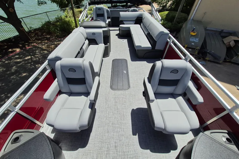 Slide: The Image of 2026 Sun Tracker Sportfish 24 XP3 pontoon boat interior with spacious seating and modern design. - 13