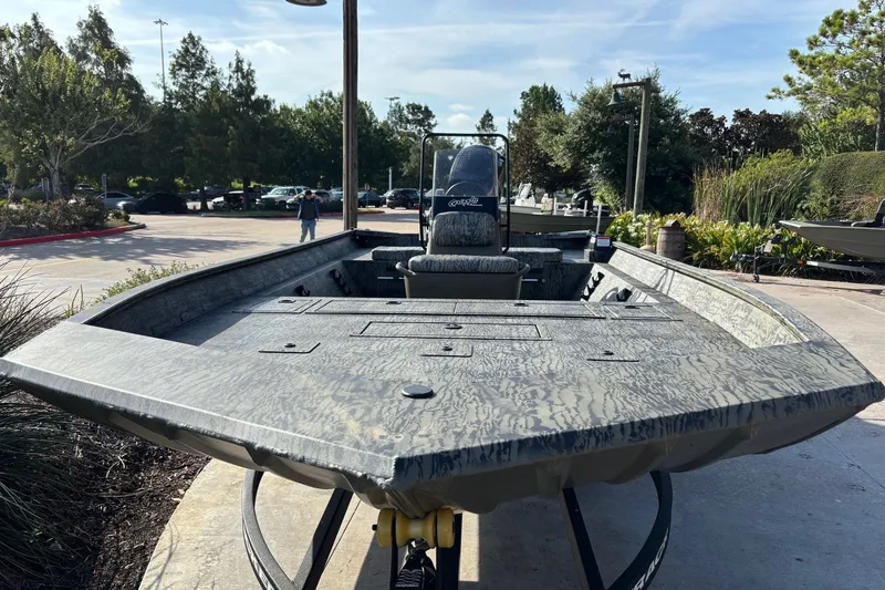 Slide: The Image of 2026 Tracker Grizzly 2072 CC boat displayed outdoors, showcasing its spacious deck and sleek design. - 3