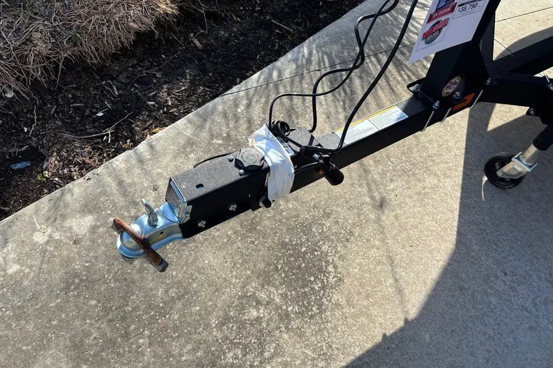 Slide: The Image of Trailer hitch of 2026 Tracker Grizzly 2072 CC on concrete pavement. - 10