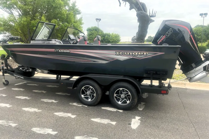 Slide: The Image of 2026 Ranger VX1988 WT boat on trailer, featuring sleek design and powerful outboard motor. - 8
