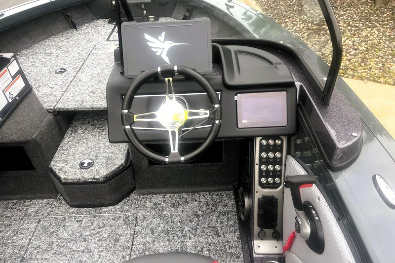 Slide: The Image of 2026 Ranger VX1988 WT boat cockpit with modern steering and control panel. - 2