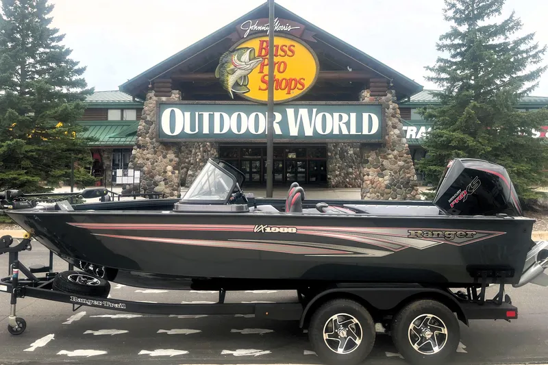 Slide: The Image of 2026 Ranger VX1988 WT boat displayed outside Bass Pro Shops Outdoor World. - 10