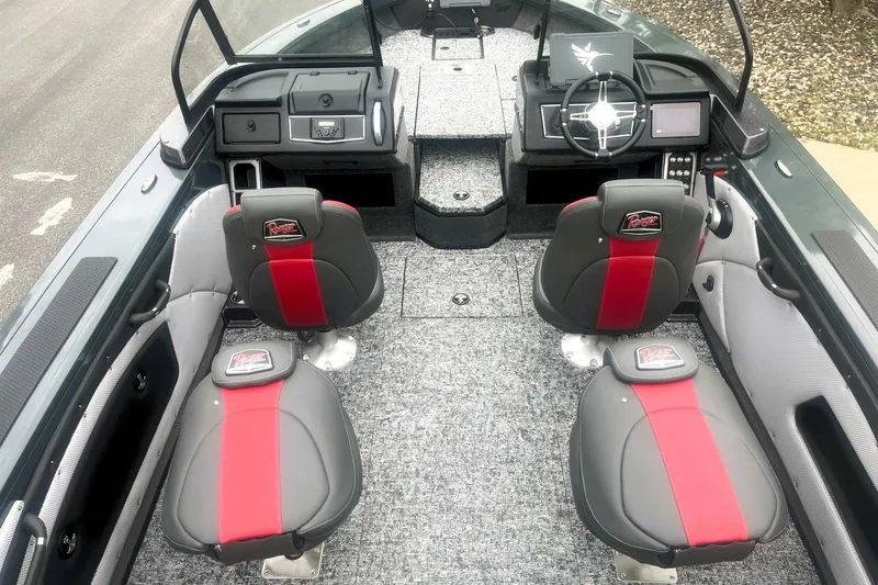 Slide: The Image of 2026 Ranger VX1988 WT boat interior with red and gray seating, modern dashboard, and carpeted flooring. - 3