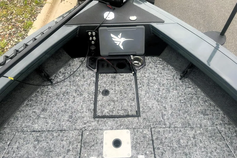 Slide: The Image of Interior of 2026 Ranger VX1988 WT boat with carpeted deck and control panel. - 6