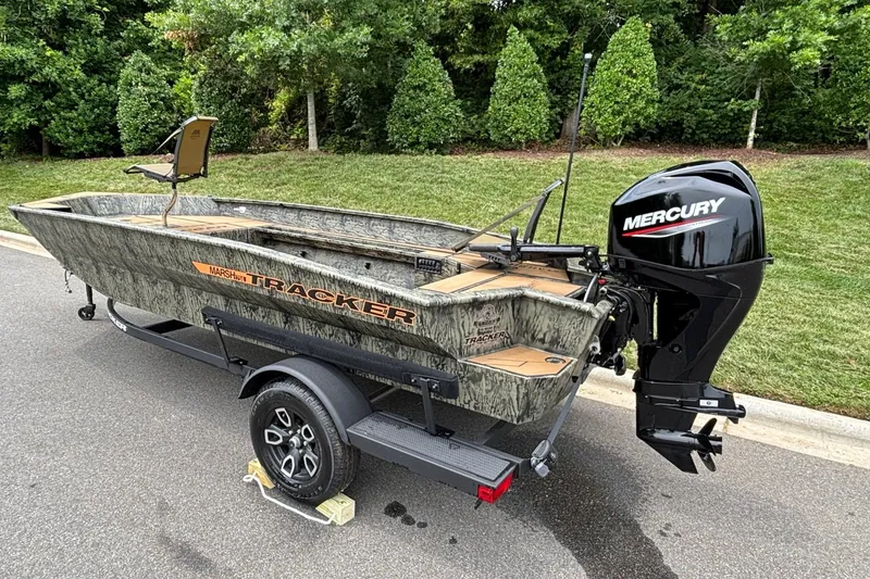 Slide: The Image of 2026 Tracker Grizzly 1756 T Marsh boat with Mercury engine on trailer. - 5