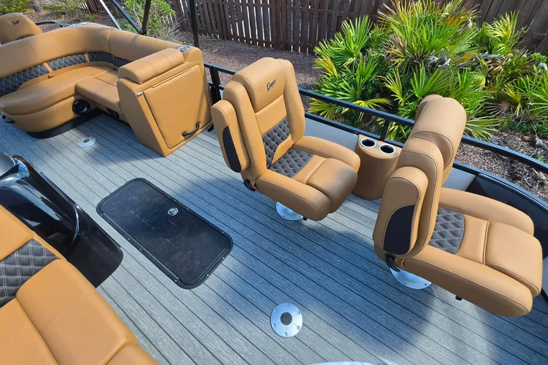 Slide: The Image of 2026 Ranger 223FC boat interior with tan leather seating and sleek design. - 21