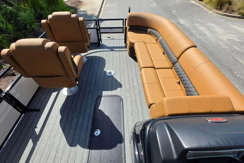 Slide: The Image of 2026 Ranger 223FC boat interior with tan seating and modern design. - 20