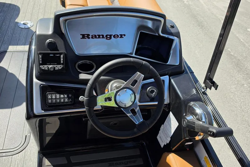 Slide: The Image of Steering console of 2026 Ranger 223FC boat with modern controls and dashboard. - 15