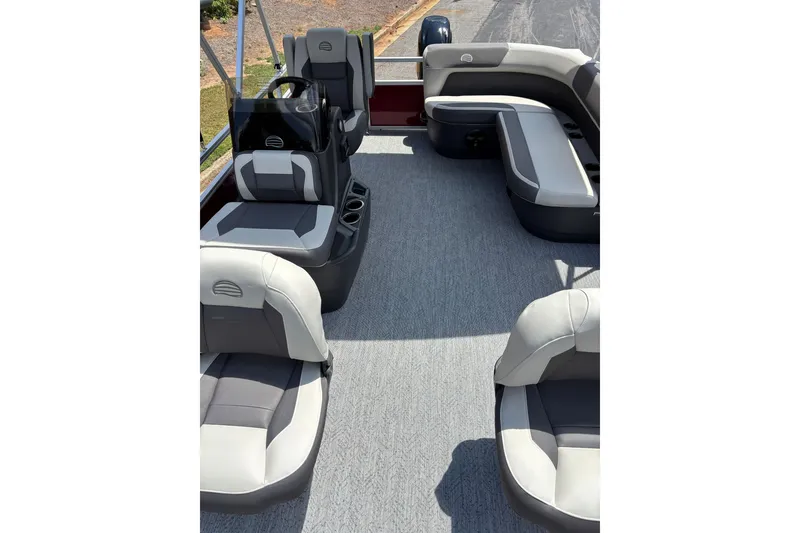 Slide: The Image of 2026 Sun Tracker Bass Buggy 16 XL Select interior with gray seating and spacious layout. - 4