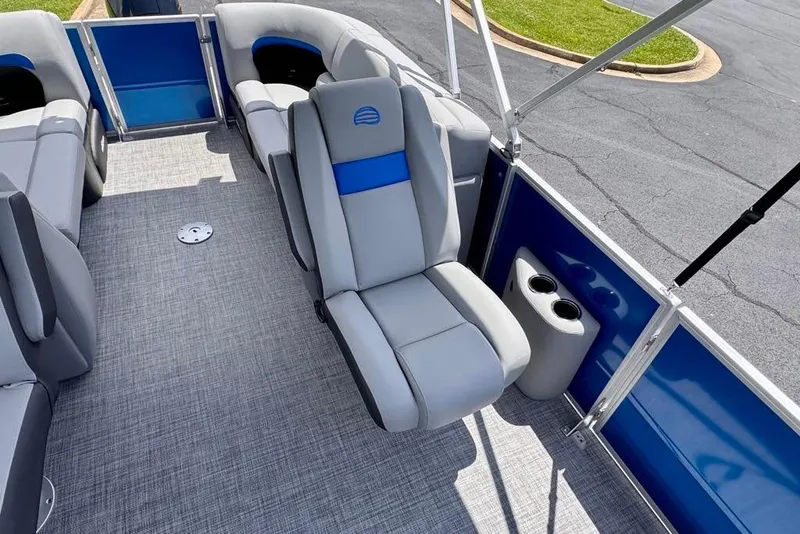 Slide: The Image of 2026 Sun Tracker Party Barge 22 XP3 interior with gray seating and blue accents. - 11