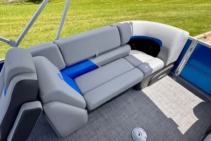 Slide: The Image of 2026 Sun Tracker Party Barge 22 XP3 interior with gray and blue seating on a pontoon boat. - 10