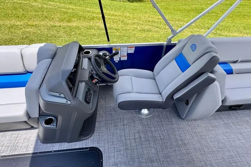 Slide: The Image of 2026 Sun Tracker Party Barge 22 XP3 interior with steering console and seating. - 12