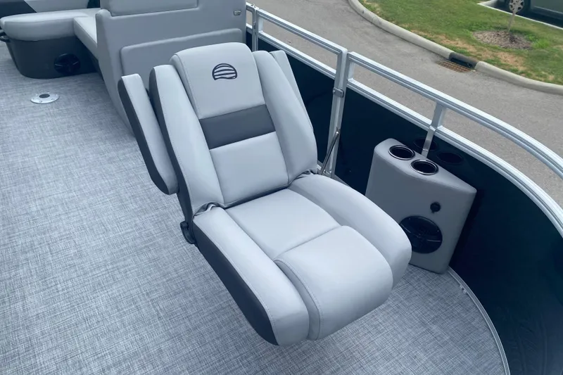 Slide: The Image of Luxurious seating on 2026 Sun Tracker SportFish 20 DLX pontoon boat, featuring cup holders. - 6