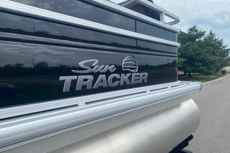 Slide: The Image of 2026 Sun Tracker SportFish 20 DLX pontoon boat, sleek design with logo detail. - 2