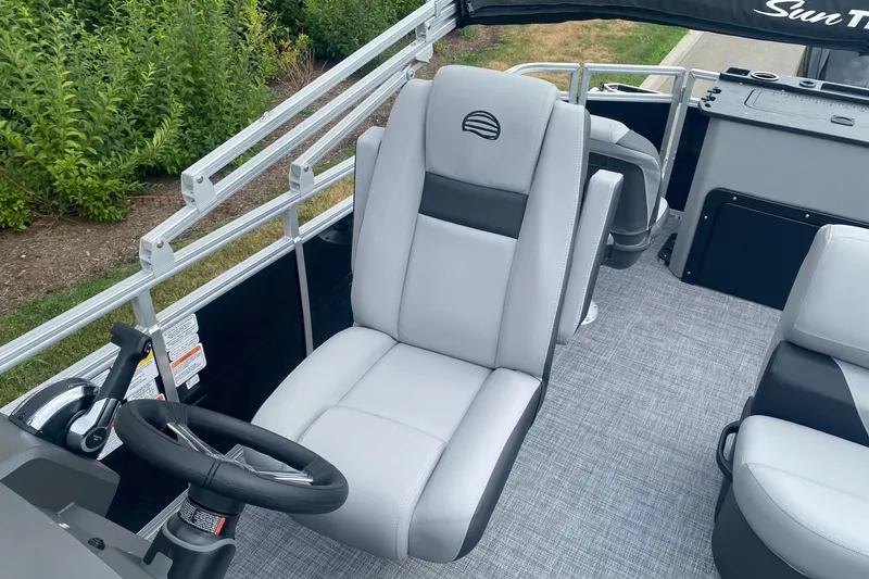 Slide: The Image of 2026 Sun Tracker SportFish 20 DLX boat interior with gray seating and steering wheel. - 7