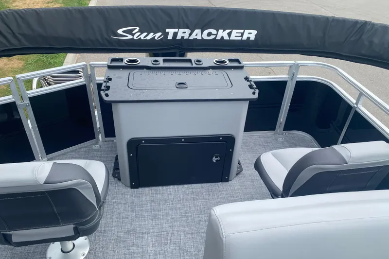 Slide: The Image of 2026 Sun Tracker SportFish 20 DLX boat interior with seating and fishing station. - 10