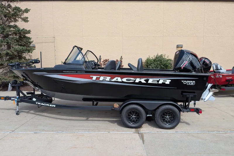 The Image of 2026 Tracker Targa V-19 WT boat on trailer, black exterior, parked outdoors. - 0