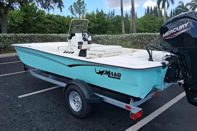 Slide: The Image of 2026 Mako Pro Skiff 17 CC boat on trailer with Mercury outboard motor. - 6