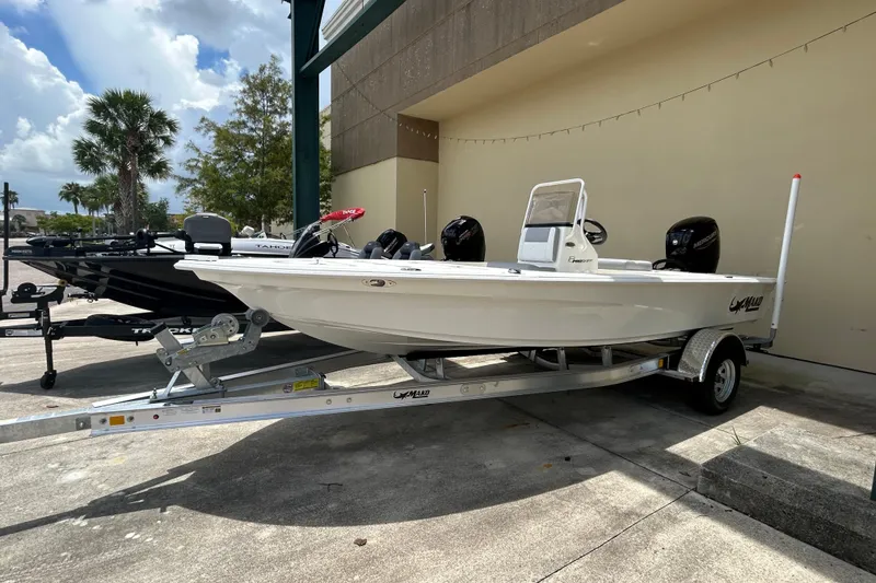 The Image of 2026 Mako 18 Pro Skiff boat on trailer, parked outdoors. - 0