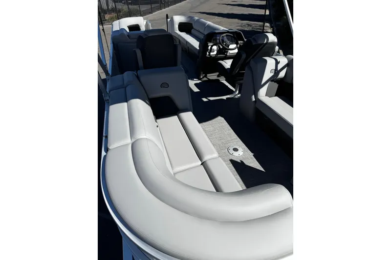 Slide: The Image of 2026 Sun Tracker Party Barge 24 XP3 interior with spacious seating and modern helm. - 8