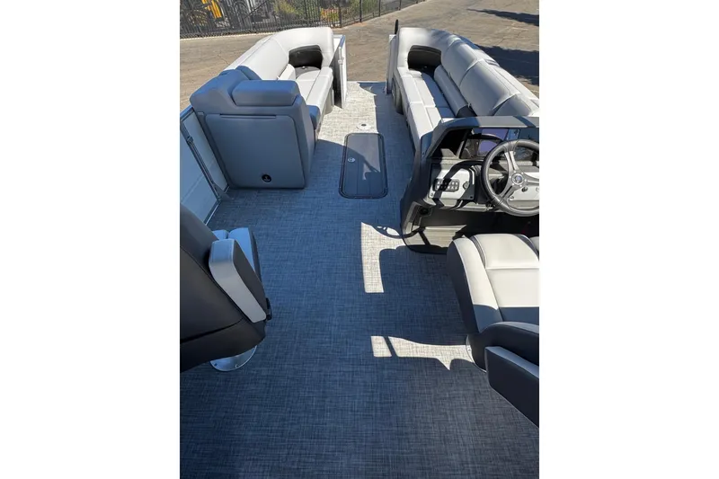 Slide: The Image of Interior view of 2026 Sun Tracker Party Barge 24 XP3 pontoon boat with seating and steering console. - 6