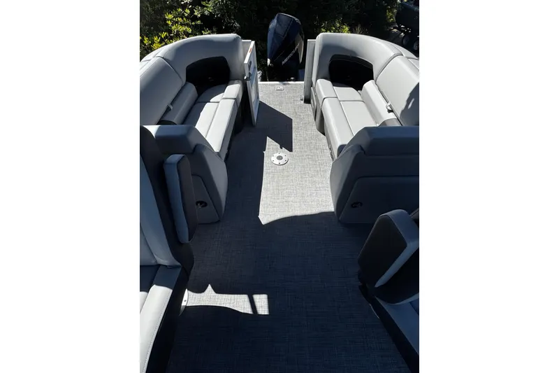Slide: The Image of 2026 Sun Tracker Party Barge 24 XP3 interior with gray seating and spacious layout. - 7