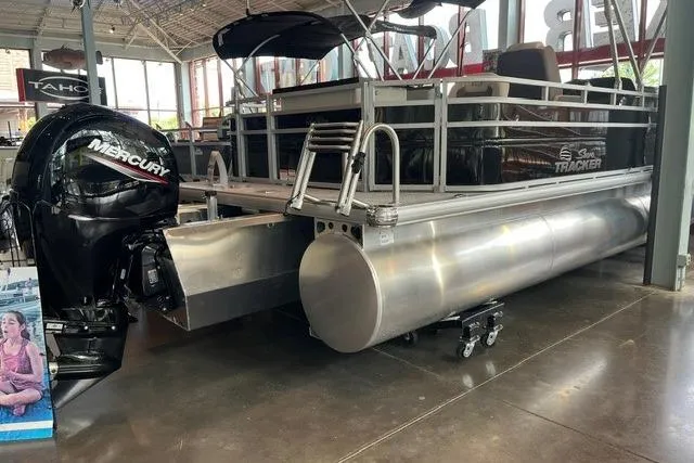 Slide: The Image of 2026 Sun Tracker Fishin' Barge 22 XP3 pontoon boat with Mercury engine in showroom. - 8