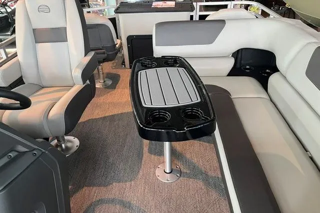 Slide: The Image of Interior of 2026 Sun Tracker Fishin' Barge 22 XP3 with seating and table. - 6