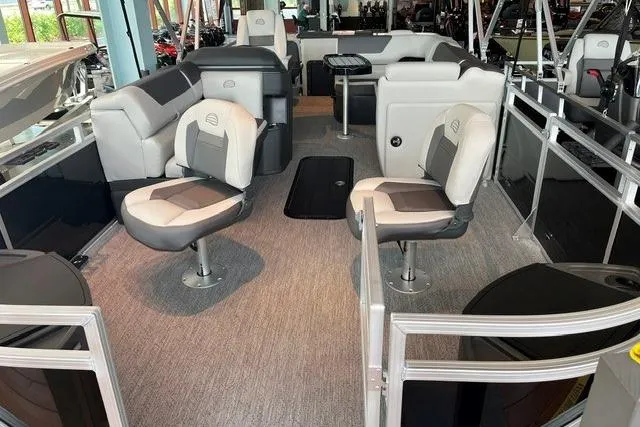 Slide: The Image of 2026 Sun Tracker Fishin' Barge 22 XP3 interior with seating and fishing amenities. - 2