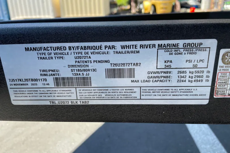 Slide: The Image of Label on a 2026 Tracker Grizzly 2072 CC trailer, detailing specifications and compliance information. - 58