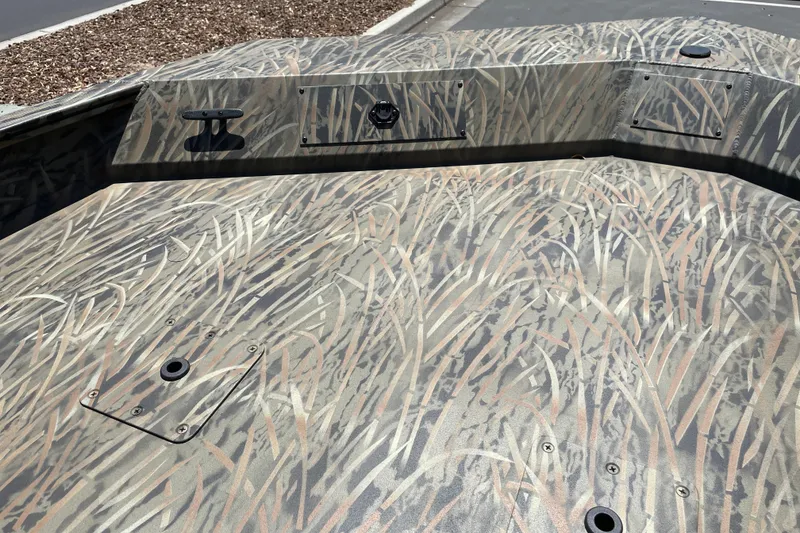 Slide: The Image of 2026 Tracker Grizzly 2072 CC boat with camouflage pattern on deck. - 9