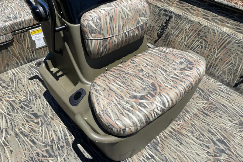Slide: The Image of 2026 Tracker Grizzly 2072 CC boat seat with camouflage pattern and sturdy design. - 11