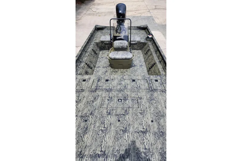 Slide: The Image of 2026 Tracker Grizzly 2072 CC boat with camouflage design and central console. - 4