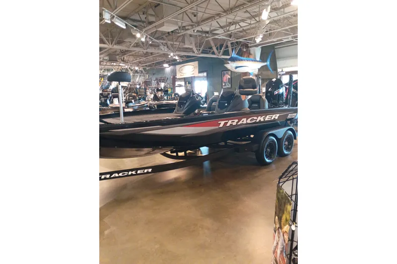 The Image of 2026 Tracker Savage 215 boat displayed in a showroom with sleek design. - 0