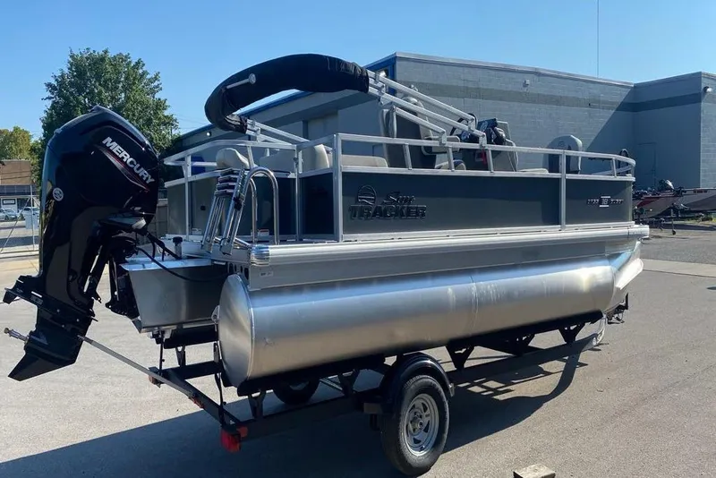 Slide: The Image of 2026 Sun Tracker Bass Buggy 18 DLX pontoon boat with Mercury outboard motor. - 6