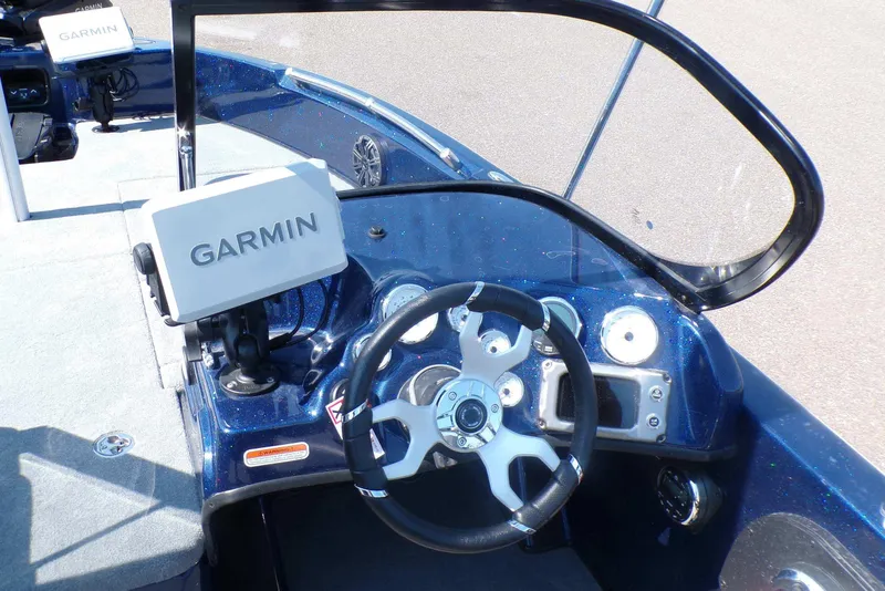 Slide: The Image of 2026 Nitro ZV19 Sport Pro boat dashboard with Garmin navigation system and steering wheel. - 3