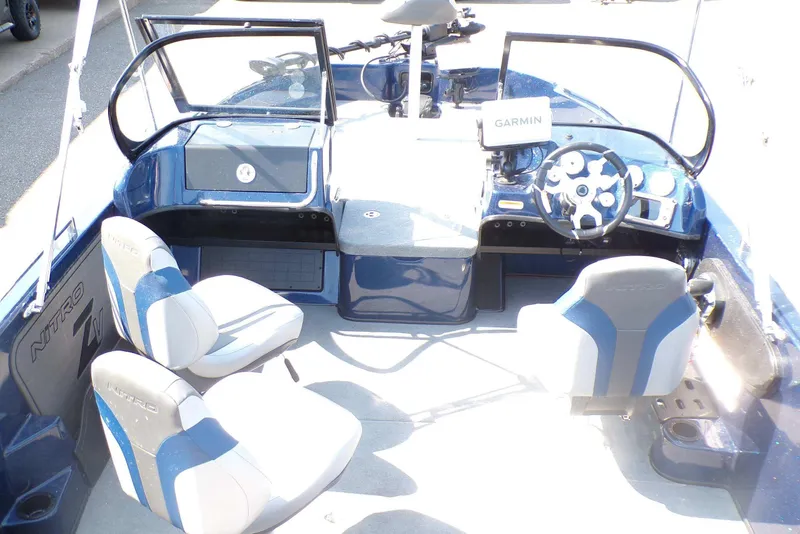 Slide: The Image of The image shows the cockpit of a Nitro ZV19 Sport Pro boat with modern seats and a Garmin device. - 5