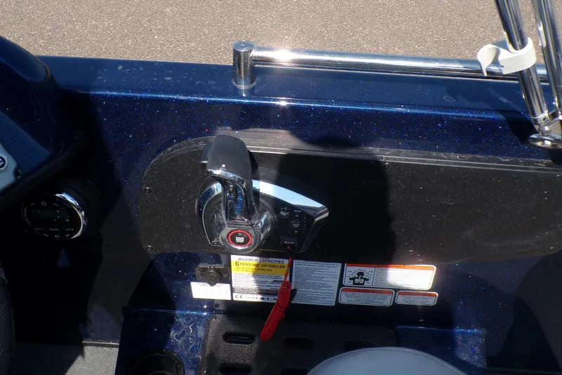 Slide: The Image of Control panel of a 2026 Nitro ZV19 Sport Pro boat with throttle lever and safety warnings. - 60