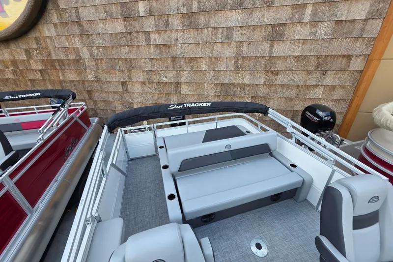 Slide: The Image of 2026 Sun Tracker Party Barge 22 RF XP3 pontoon boat interior with seating and Mercury engine. - 4
